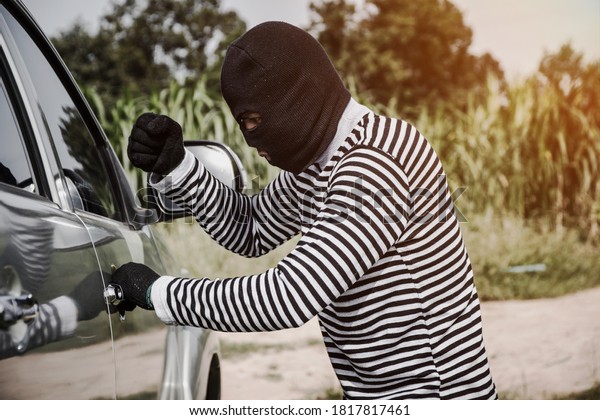 Thieves are about to steal\
cars.