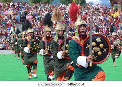 THIMPHU, BHUTAN - SEPTEMBER 25, 2015: Dochula Druk Wangyal Warrior Dance With Traditional Sword And Shield During Thimphu Tshechu.