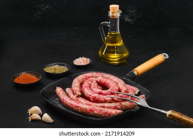 Thin beef sausages on grill pan - Shutterstock ID 2171914209