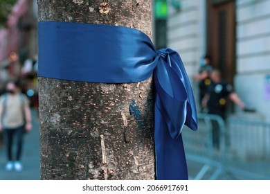 Thin Blue Line Ribbon Tied Around Tree Outside Of NYPD Precinct In Manhattan