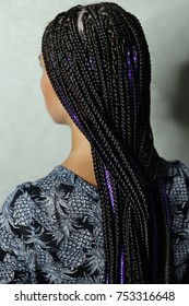 a lot of thin braids in the African style, black kanekalon, synt