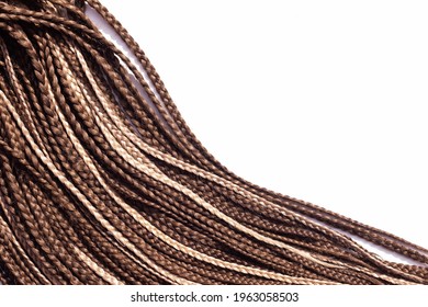 Thin Brown African Braids On A White Background. Hair Close-up Braided In Pigtails Dreadlocks, Afro Style