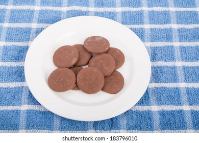 Thin Chocolate Mint Cookies On A White Plate