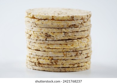 Thin corn cakes with sesame. Healthy food nutrition. Thin round corn cakes. Stack of puffed rice snack - Powered by Shutterstock