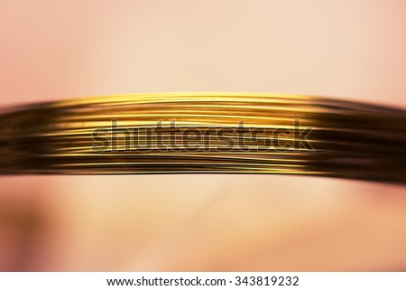 Thin gold wires high magnification macro. Shallow depth of field.