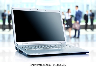 thin laptop on office desk - Powered by Shutterstock