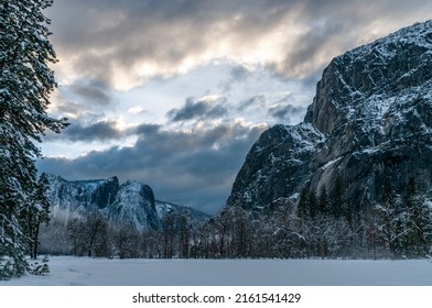 A thin layer of mis has developed in Yosemite valley floor on a snowy winter afternoon, just before sunset.