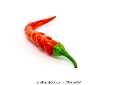 Thin red pepper with green stem