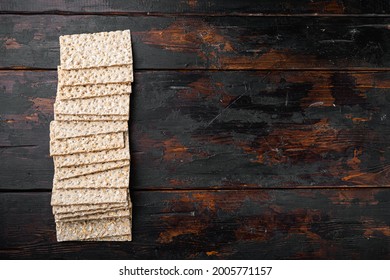 Thin rye crispy cracker set, on old dark  wooden table background, top view flat lay, with copy space for text