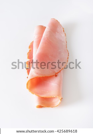 thin slice of ham on white background
