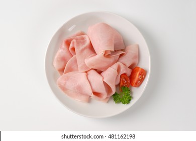 Thin Slices Of Pork Ham On White Plate