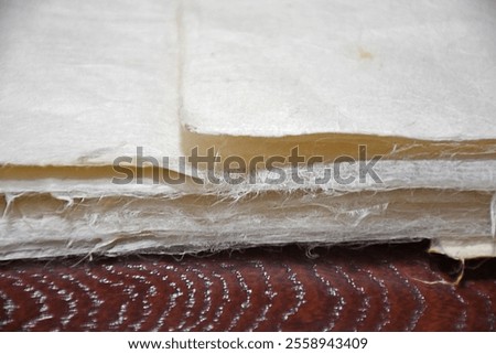 Thin, but strong and durable white sheets of white Japanese washi paper, soft and white with a smooth texture. It uses local fiber, processed by hand and made in the traditional manner.