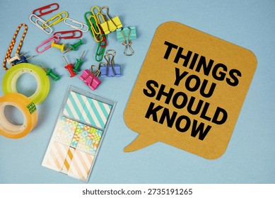 Things You Should Know text with stationery on blue background