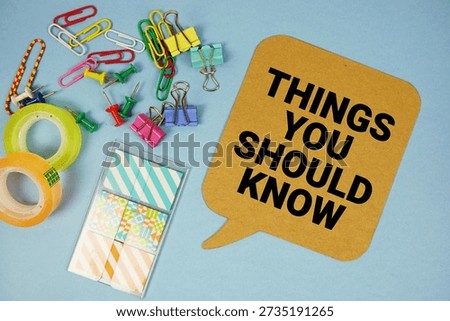 Things You Should Know text with stationery on blue background