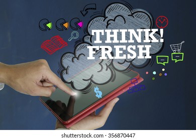 THINK FRESH over a tablet computer on dark blue background , business concept ,business idea