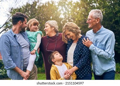 Think our hands are full, you should see our heart. Shot of a multigenerational family outside. - Powered by Shutterstock