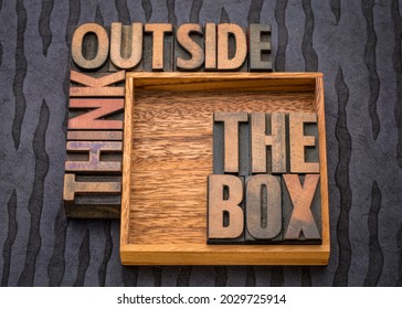 think outside the box concept- motivational phrase in vintage letterpress wood type, business, education, science and personal development concept