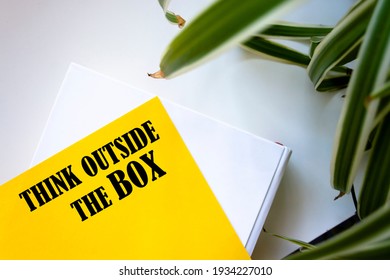 Think Outside the Box write on Sticky Notes.