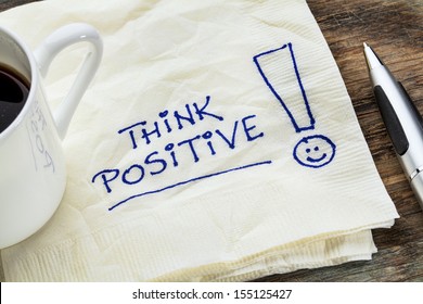 think positive - motivational slogan on a napkin with a cup of coffee - Shutterstock ID 155125427