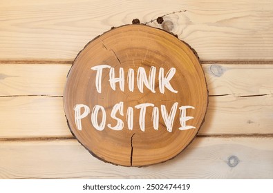 Think positive symbol. Concept words Think positive on beautiful wooden circle. Beautiful wooden wall background. Business, motivational think positive thinking concept. Copy space. - Powered by Shutterstock