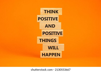 Think positive symbol. Wooden blocks with words Think positive and positive things will happen. Beautiful orange table, orange background, copy space. Business, motivational think positive concept.