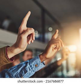 Think for yourself but question everything. Cropped shot of hands being raised to ask a question.