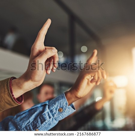 Think for yourself but question everything. Cropped shot of hands being raised to ask a question.