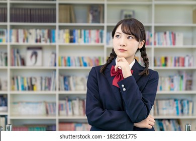 Thinking Asian Female High School Student.