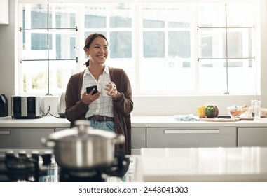 Thinking, Asian woman or coffee to relax, phone or browse on social media, website or app in kitchen. Gen z girl, happy or smartphone to drink, update or post of meme to connect at weekend of leisure - Powered by Shutterstock