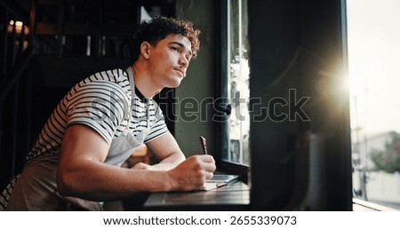 Thinking, barista and man writing notes in cafe for inventory list, stock or planning menu. Reflection, coffee shop or small business owner with journal for ideas, sales checklist or vision by window