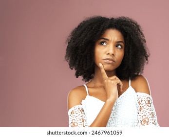 Thinking, black woman and ideas for confused in studio with question, doubt and decision by problem solving for solution. African, female person and thoughtful with choice on pink background - Powered by Shutterstock