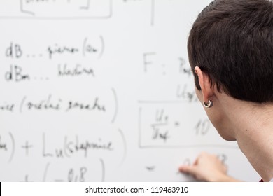 Thinking Boy With Whiteboard Solving Equation