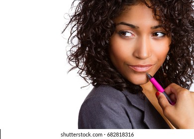 Thinking business woman holding pen
