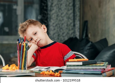 Thinking Child Bored, Frustrated And Fed Up Doing His Homework