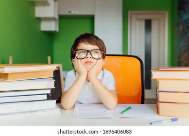 Thinking Child Bored, Frustrated And Fed Up Doing His Homework