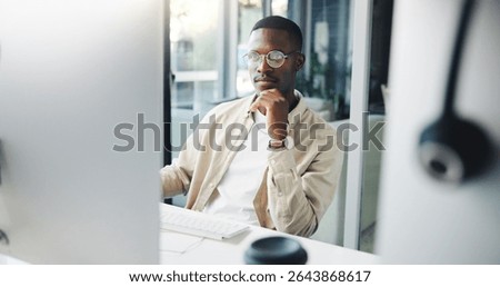 Thinking, computer and black man in office with ideas, research or brainstorming for creative project. Planning, technology and African male editor working on article for publishing at agency.