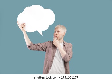 Thinking concept. Albino guy with speech bubble deep in thought posing on color background, space for text. Thoughtful man with empty word cloud, mockup for your ad or design - Powered by Shutterstock