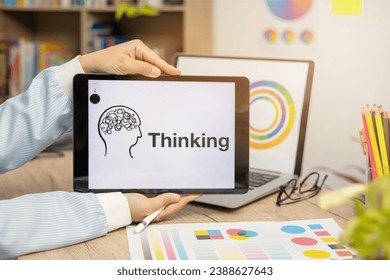 Thinking concept:  tablet presentation of keywords on the table for creative work or business