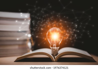 Thinking and creative concept, Light bulb on the Book and light bulb style bokeh vintage dark background,Concept The idea of reading books, knowledge, and searching for new ideas. - Powered by Shutterstock