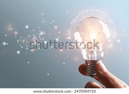 thinking and creative light bulb in human hands