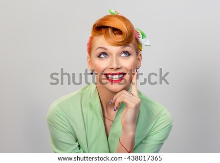 Thinking, daydreaming. Closeup portrait headshot thoughtful cute woman looking up isolated grey gray wall background copy space above head. Human face expressions, emotions, feelings body language