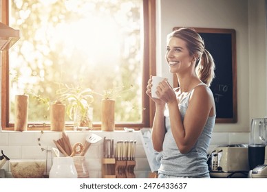 Thinking, drinking coffee and happy woman in home kitchen for relax, peace or calm in morning. Smile, tea cup and person dream of planning future, idea and decision with latte beverage in apartment - Powered by Shutterstock