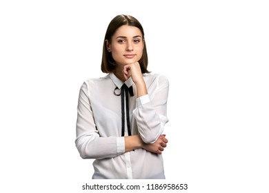 Thinking girl isolated on white background. Young pretty woman in elegant blouse looking thoughtful over white background.
