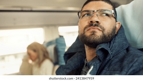 Thinking, idea and young businessman on a train for public transportation to work in the city. Reflection, planning and professional male person from Mexico commuting to office in urban town. - Powered by Shutterstock