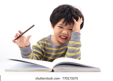 Thinking Little Asian Boy Bored, Frustrated And Fed Up Doing His Homework, Isolated On White Background.