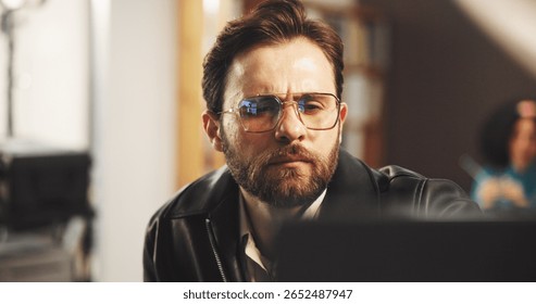 Thinking, man and editor in studio for editing with post production, process or casting online. Planning, solution and director watching scenes for artistic project with shoot at creative agency.