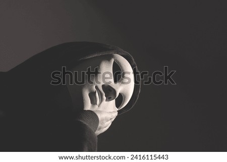 thinking man with face covered by a mask, abstract concept