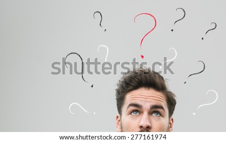 thinking man with many question marks above his head, against grey background