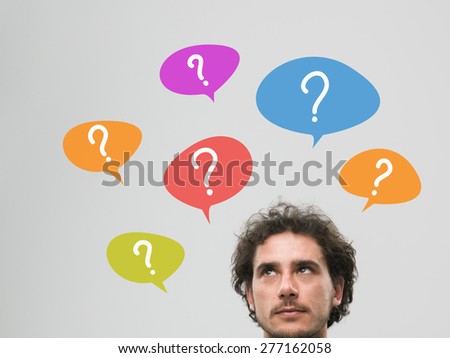 thinking man with many question marks in bubbles above his head, against grey background