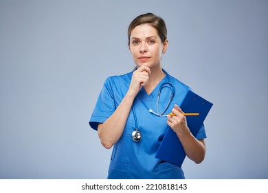 Thinking Nurse Woman Holding Clipboard. Isolated Portrait.